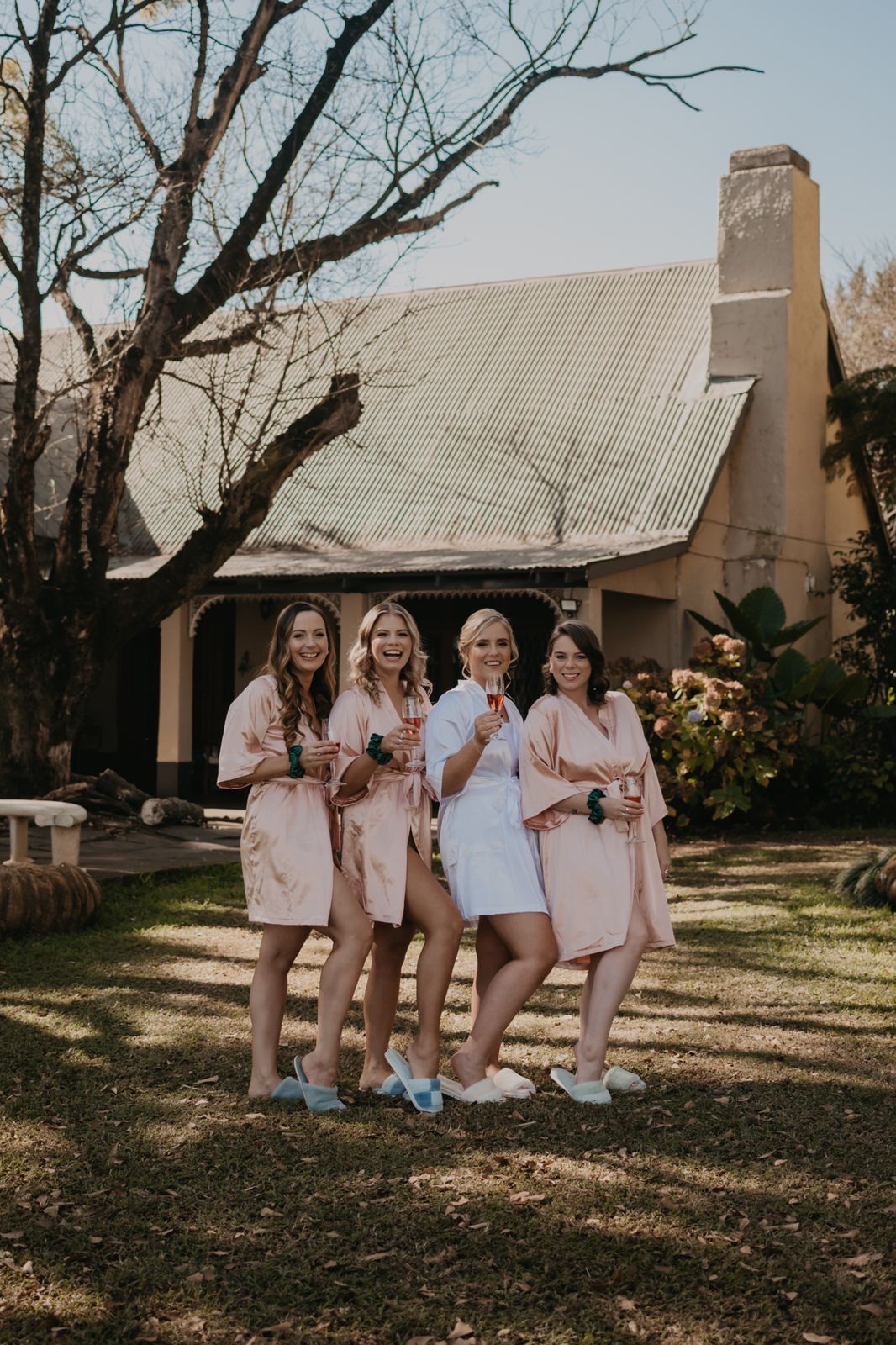 bridal ladies standing in front of house at Glen Gray farm